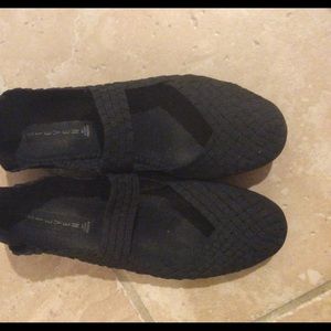 Black flat Mary Jane style shoes
